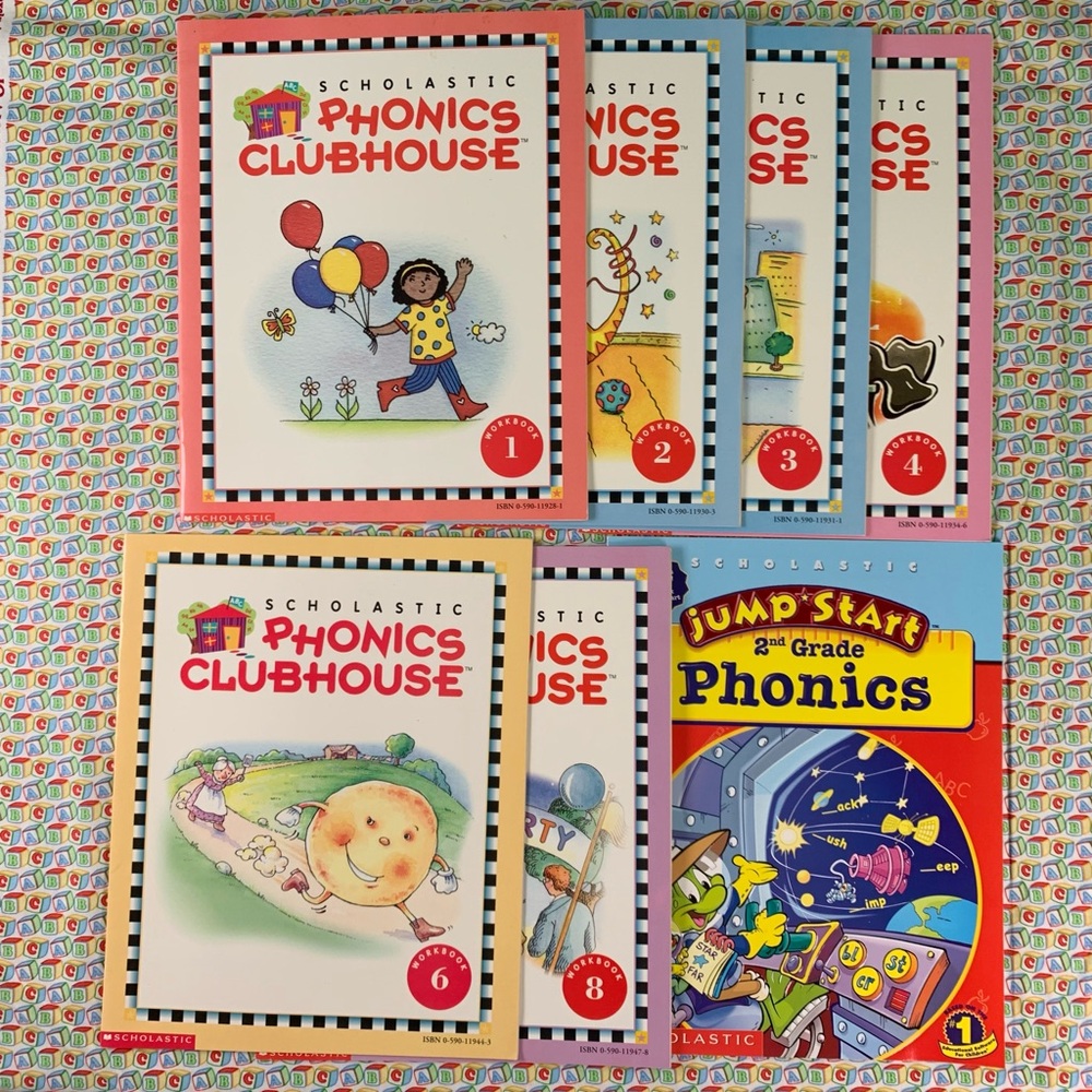 Scholastic Phonics Clubhouse Workbooks 1-4, 6, 8 and a Jump Start book.